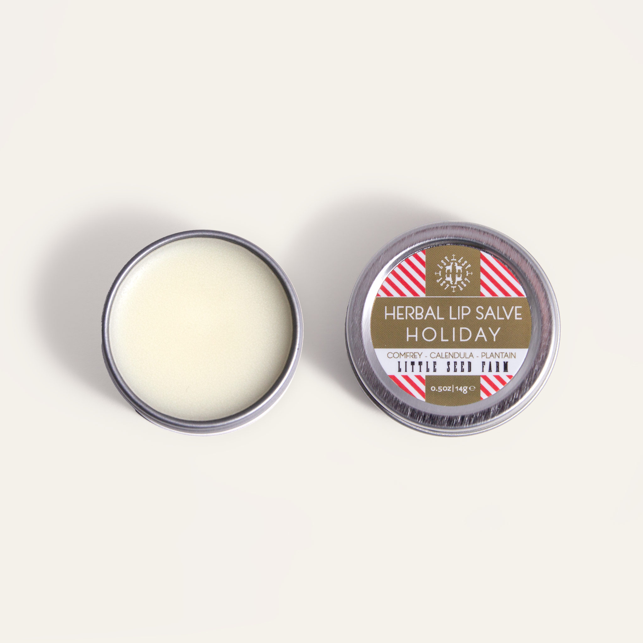 Holiday Lip Salve seasonal limited edition from Little Seed Farm: peppermint‑vanilla herbal balm made with organic butters and healing botanicals to soothe and hydrate lips.