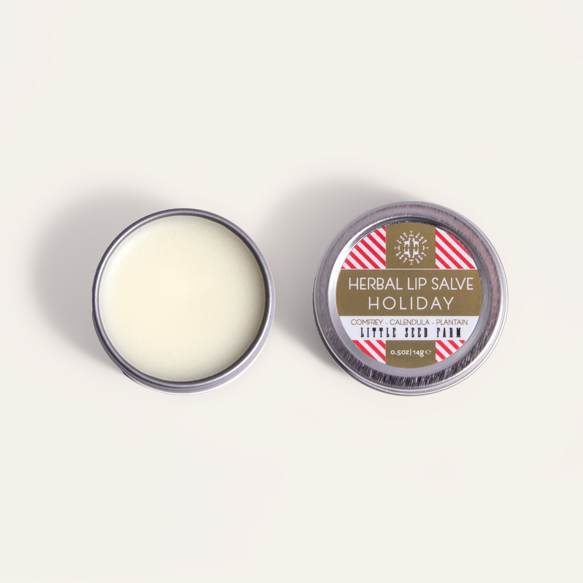 Holiday Lip Salve seasonal limited edition from Little Seed Farm: peppermint‑vanilla herbal balm made with organic butters and healing botanicals to soothe and hydrate lips.