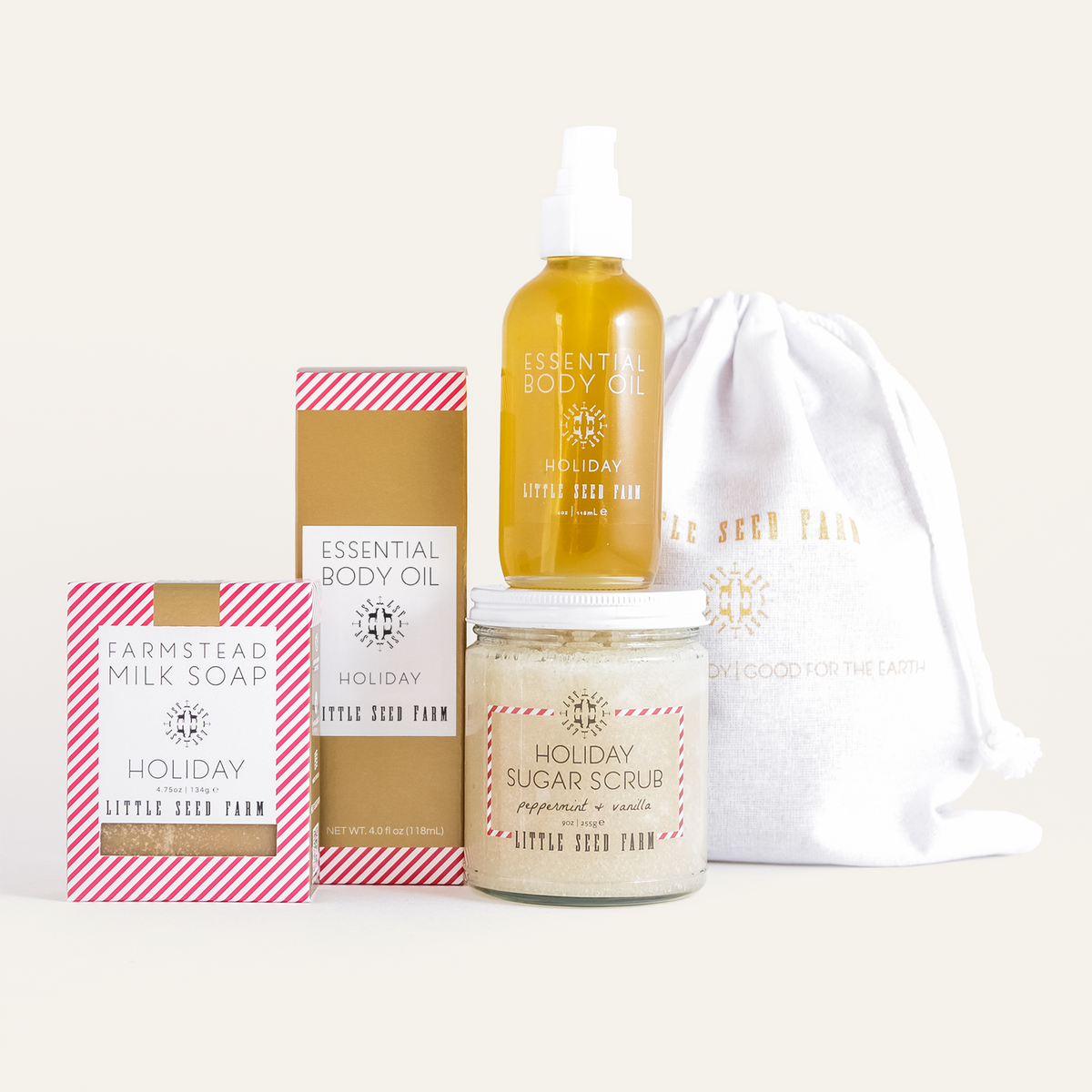 the little seed farm holiday shower set including the holiday goats milk soap, body oil and sugar scrub.