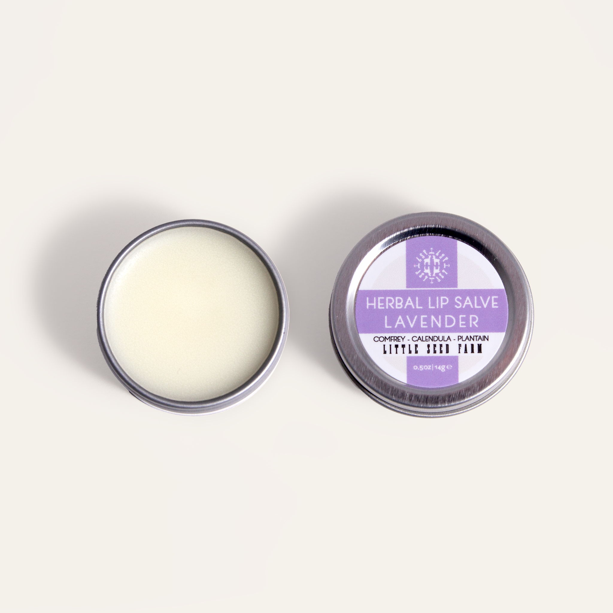 Lavender Lip Salve: a calming herbal tin balm made with organic shea butter, sweet almond oil, beeswax, and infused coconut oil for healing dry or cracked lips.