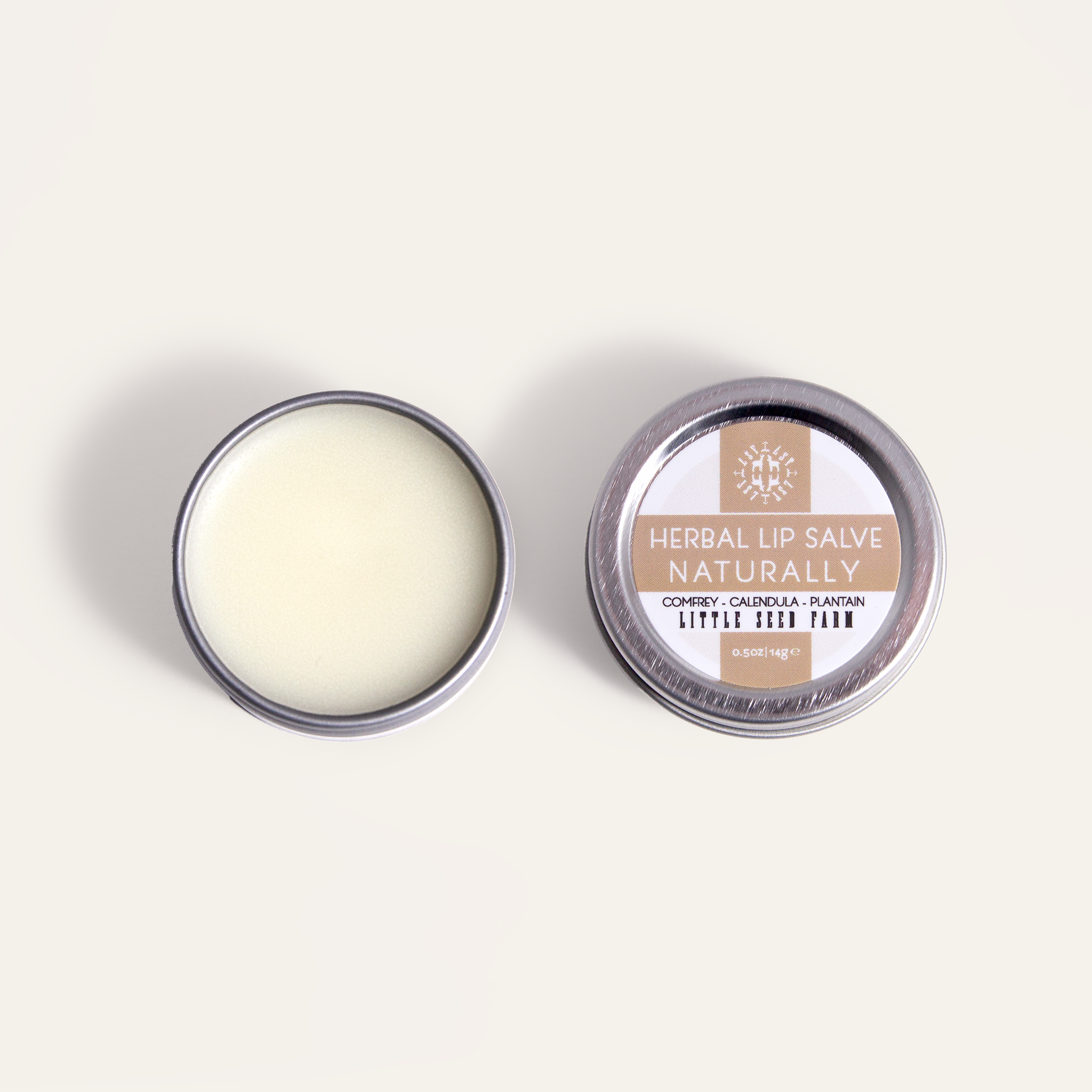 Naturally Unscented Herbal Lip Salve: a gentle balm made with organic shea butter, sweet almond and coconut oils infused with calendula, comfrey, and plantain to soothe dry or cracked lips.