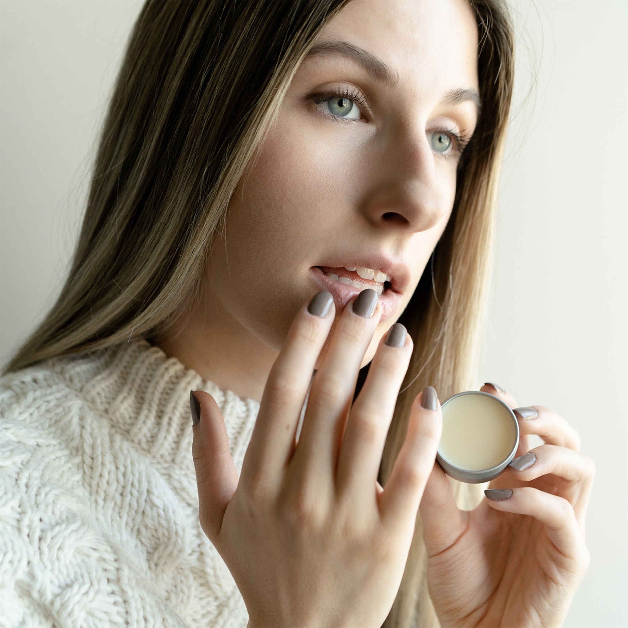 Herbal lip salve in a reusable tin, perfect for softening lips, cuticles, or dry patches with nourishing botanical oils.