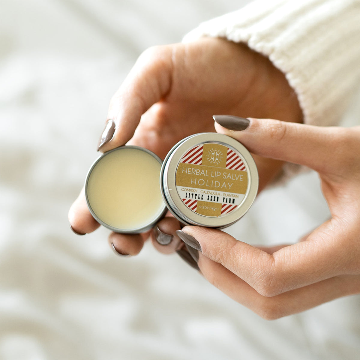 Peppermint‑vanilla herbal lip salve in a reusable tin, perfect for softening lips, cuticles, or dry patches with nourishing botanical oils.