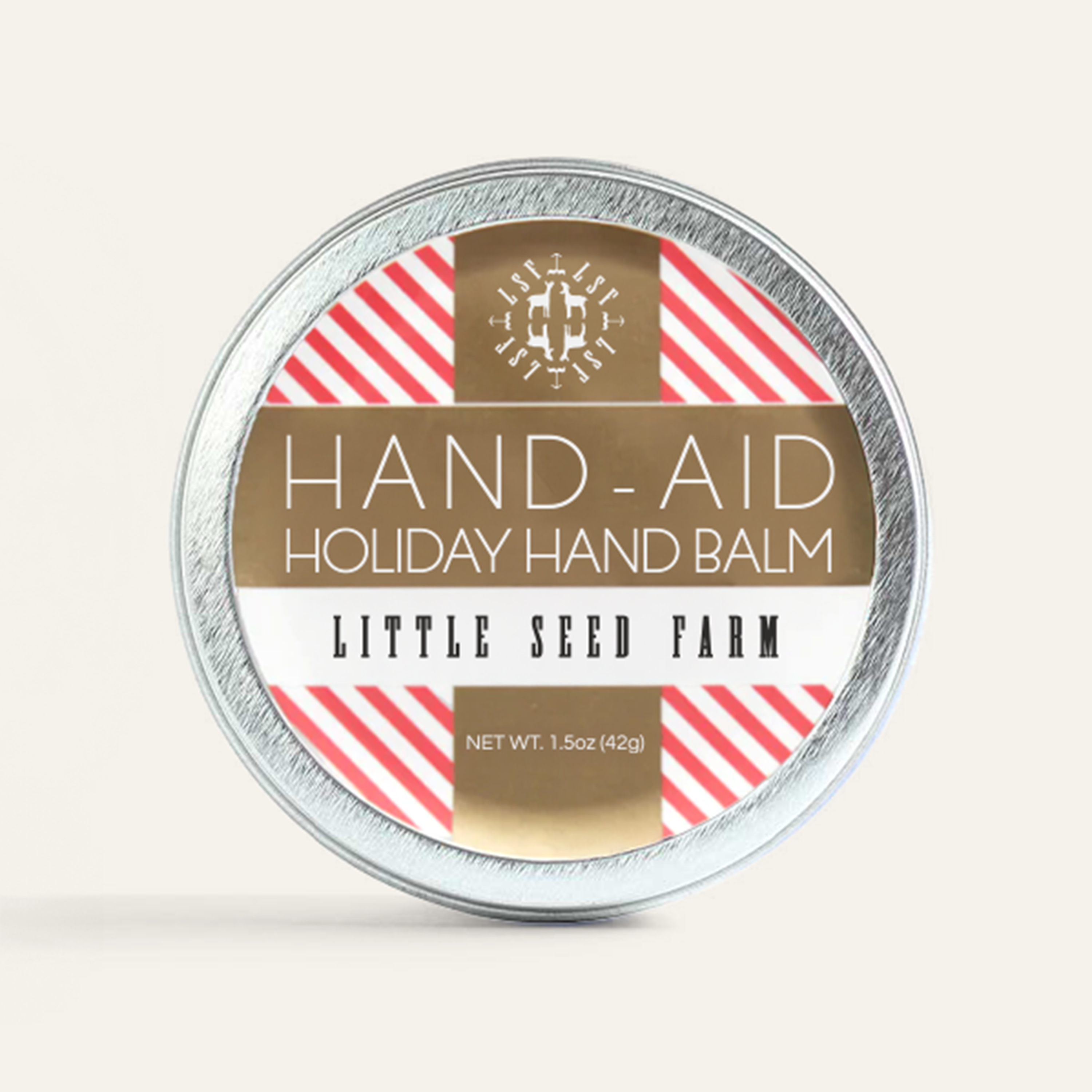 a tin of little seed farm holiday hand aid.
