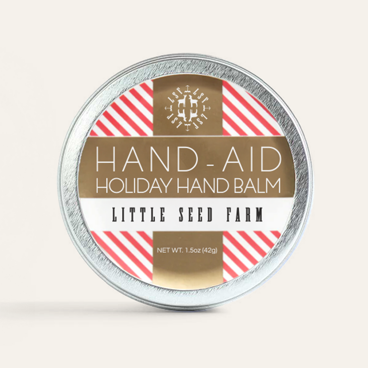 a tin of little seed farm holiday hand aid.
