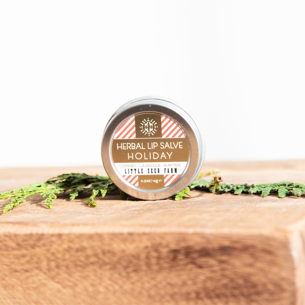 Peppermint‑vanilla herbal lip salve in a reusable tin, perfect for softening lips, cuticles, or dry patches with nourishing botanical oils.