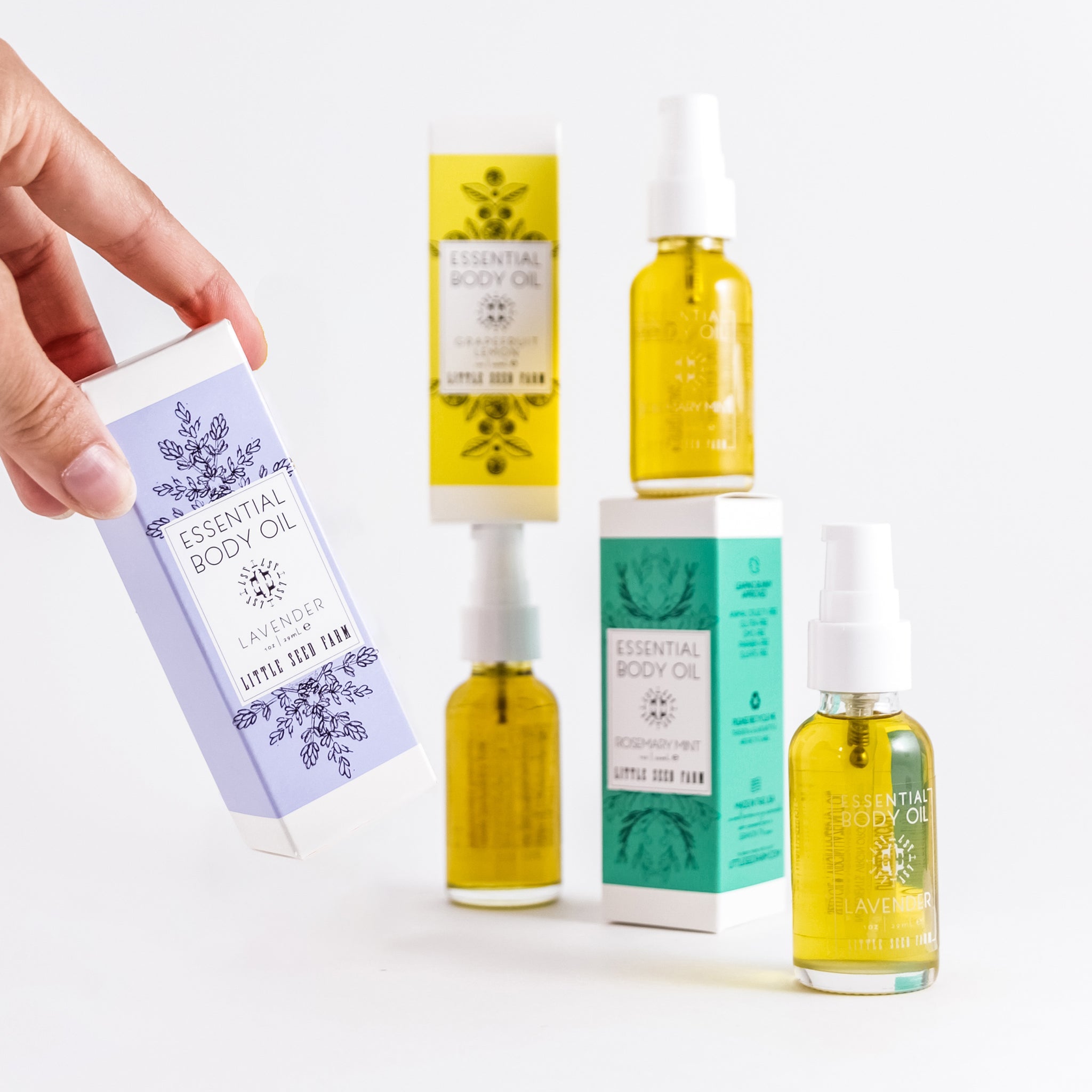 Ingredients of Essential Body Oil include CERTIFIED ORGANIC hazelnut and hemp seed oils plus vitamin E, delivering a nutrient-dense lipid barrier for soft, hydrated skin.