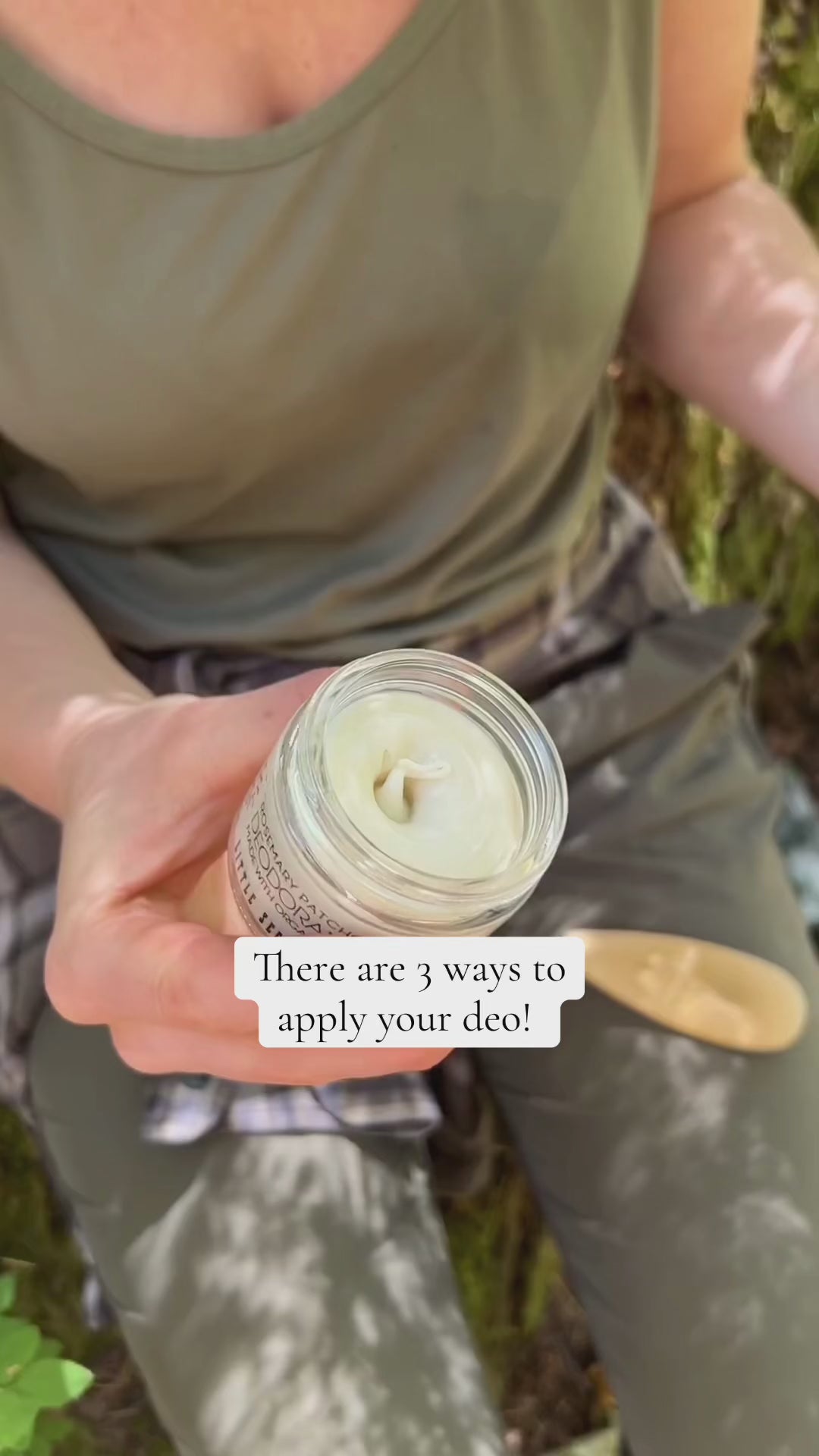 Person holding jar and applying unscented deodorant cream onto skin, demonstrating how to use it
