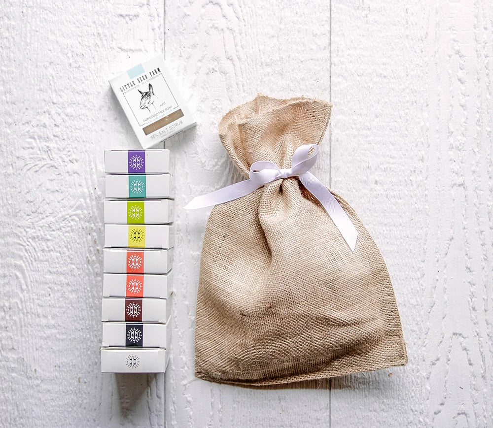 The Soap Rainbow bundle showcasing Little Seed Farm’s twelve handcrafted goat milk soap bars made in small batches on a regenerative solar‑powered farm with sustainable, cruelty‑free ingredients
