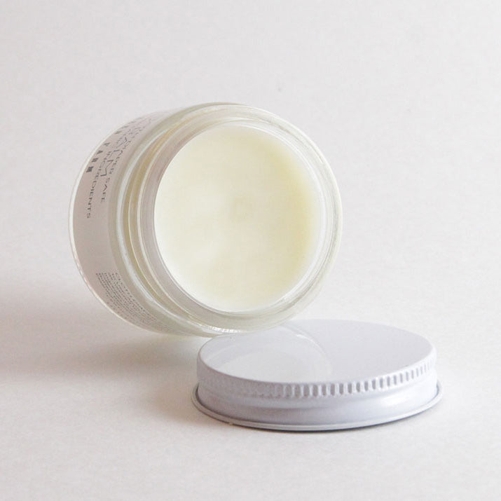 Close-up of the Booty Balm for Babies jar, showcasing its smooth, creamy texture and eco-friendly packaging.